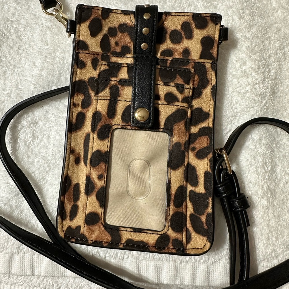 Phone case with purse strap. Leopard and black size is 4 inch by 7 inch like new